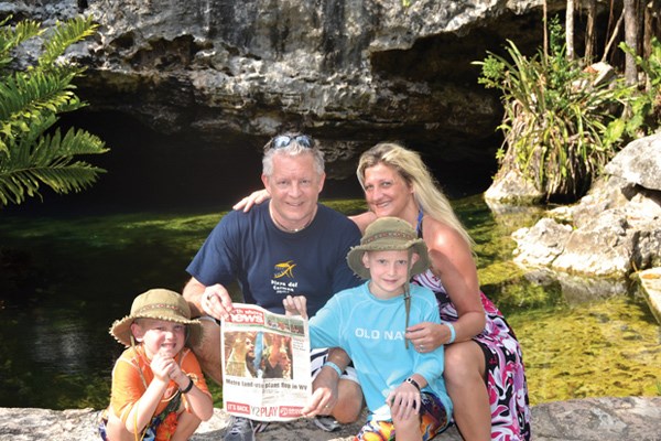 Ryan, Doug, Clayton and Sandra Hunter take a break with the News at the Cristalino Cenote, a water-filled sinkhole in Riviera Maya, Mexico.