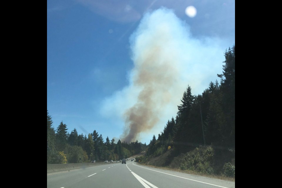 Smoke from a wildfire near Bamberton rises above the Malahat on Thursday, Aug. 25, 2016. Firefighters from four departments and the Coastal Fire Centre are battling the blaze.