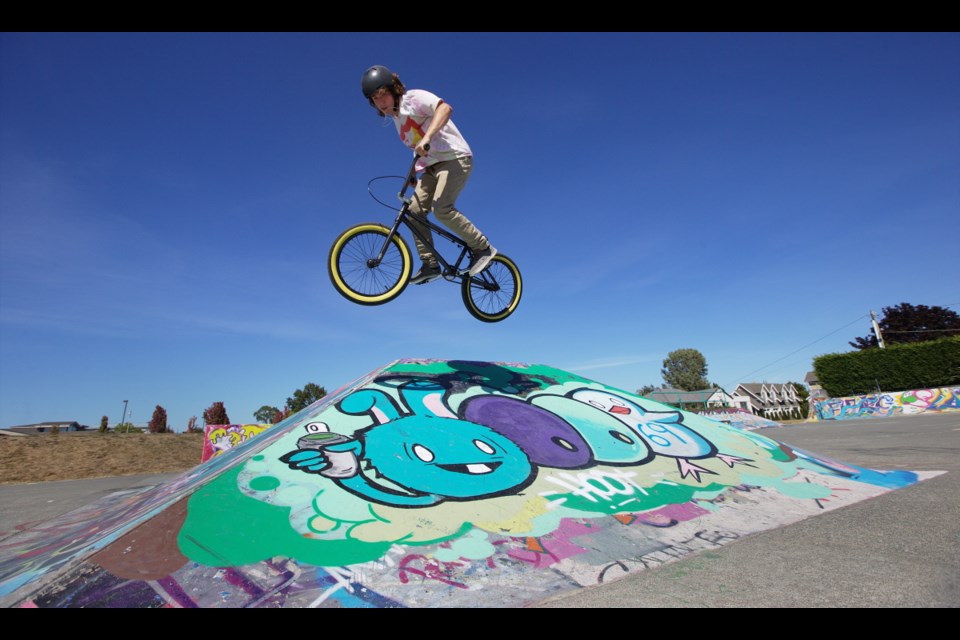 Chris Archibold jumps his BMX bike at Tulista Park in Sidney. A new skate park is being built at the north end of the park.