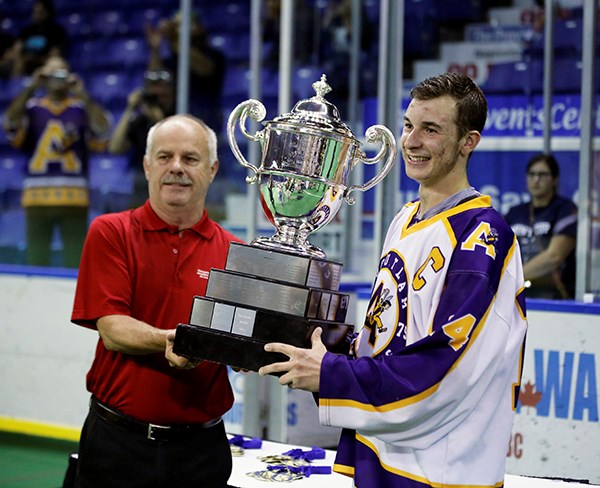 Coquitlam Adanac captain Tyler Pace receives the Minto Cup after his team defeated the Orangeville Northmen 6-5 in overtime Monday night.