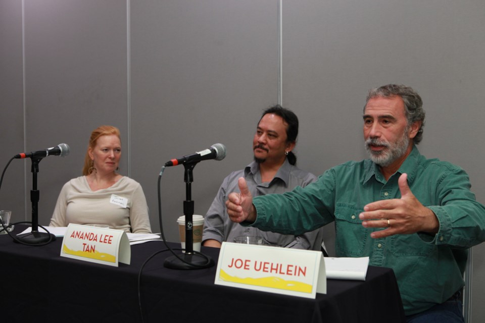 Burnaby resident Ananda Lee Tan (centre) says unions have to take on a leadership role to help form a new, community-based economy that protects the environment and jobs.