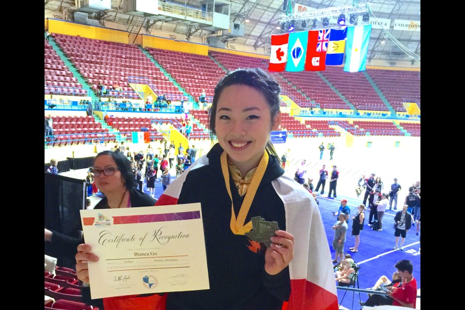 Bianca Go at the 11th Pan Am Wushu Championships in Texas with one of the two medals she won to secure a spot on the Canadian team headed to the upcoming Junior Worlds in Bulgaria.