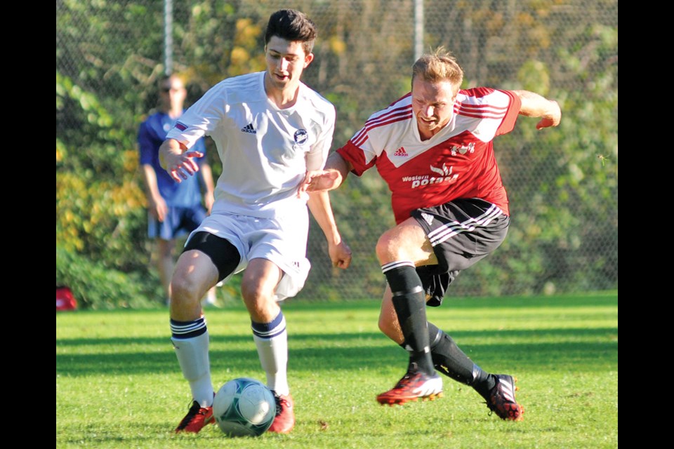 Daniel Morello of the Capilano Blues takes control during an exhibition matchup last month. The Blues, defending PacWest champions, will begin their title defence on the road against Quest Wednesday night before hosting Langara in their home opener Saturday at the Capilano Sportsplex. photo by Paul McGrath, North Shore News