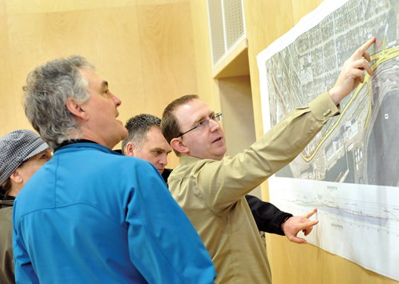 Port Metro Vancouver's Richard Lyell (centre) discusses the port's redesign options for the Low Level Road at an open house on Saturday at Ridgeway elementary.