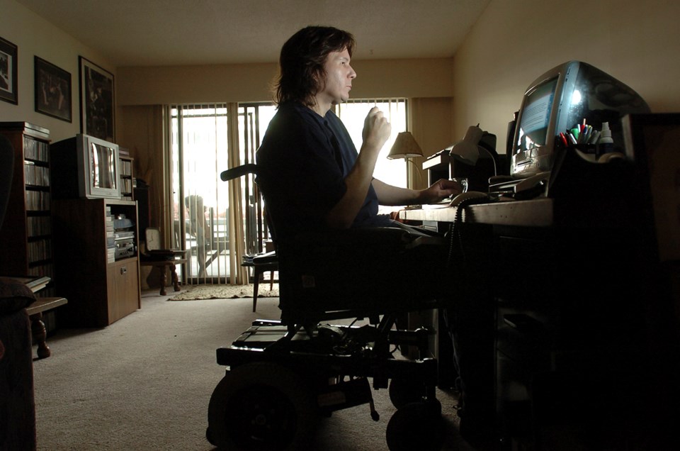 Greg Potter gets back to writing in his new apartment. Photo: Dan Toulgoet