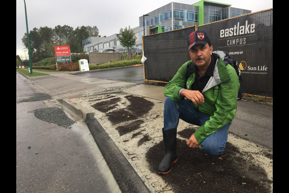 Burnaby streamkeeper John Preissl in front of Adera’s construction site on Eastlake Drive. The site was hit with a deluge of water that overwhelmed the pump and filtration systems designed to keep silty runoff from escaping.