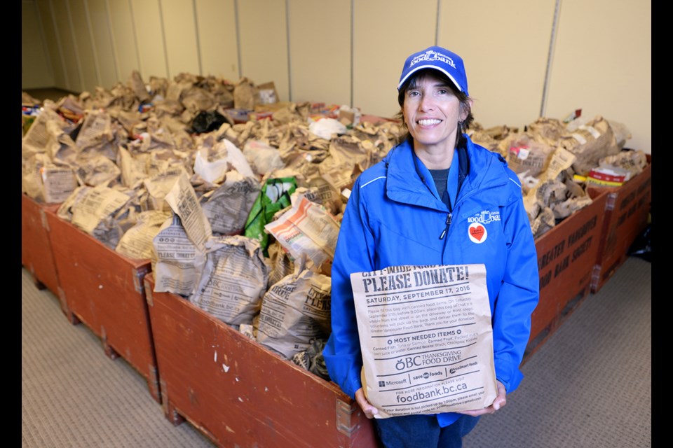 Food bank communications director Ariela Friedmann with donations at Save-On-Foods in Burnaby.