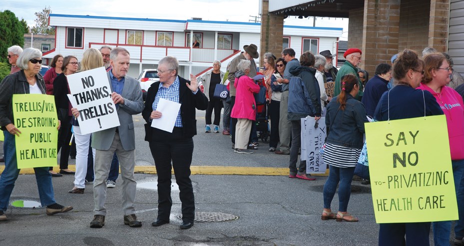 Kath-Ann Terrett of the BCNU talks with one of the protesters outside the Sept. 19 Trellis open house in Sechelt.
