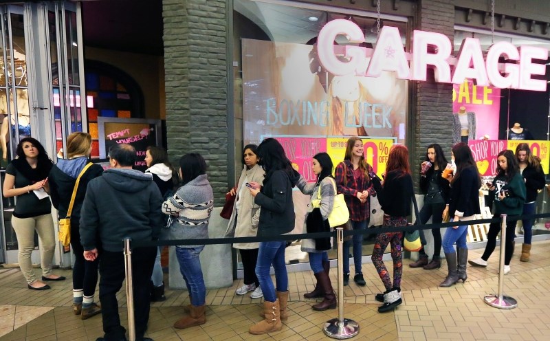 Shoppers line up for a Boxing Day sale. - photo