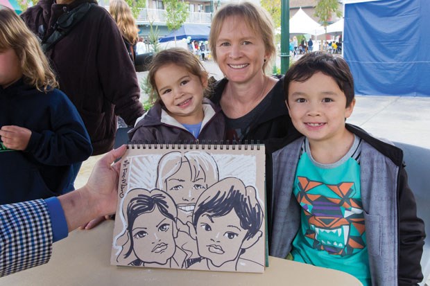 With the Delta Street revitalization work nearing completion, a Ladner Village Celebration was held last Saturday. Mom Dana with kids Sachi and Koji had their portraits drawn by caricature artist Mr Fire-Man.