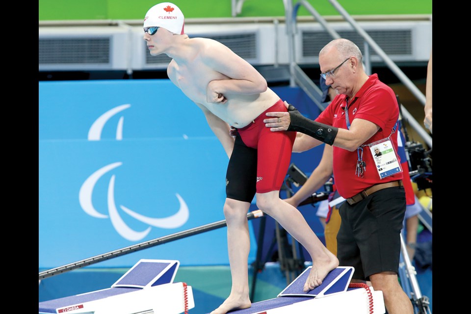 West Vancouver’s Nathan Clement steadies himself with the help of coach Craig McCord moments before the start of the S6 50-metre final at the Paralympic Games in Rio de Janeiro. Clement set a new Canadian record while finishing seventh. photo supplied Scott Grant/Canadian Paralympic Committee