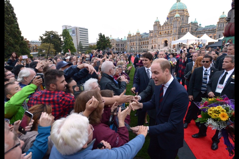 The Duke of Cambridge, with Prime Minister Justin Trudeau in tow, greets onlookers in front of the Legislative Assembly in Victoria, B.C., on Saturday, September 24, 2016.