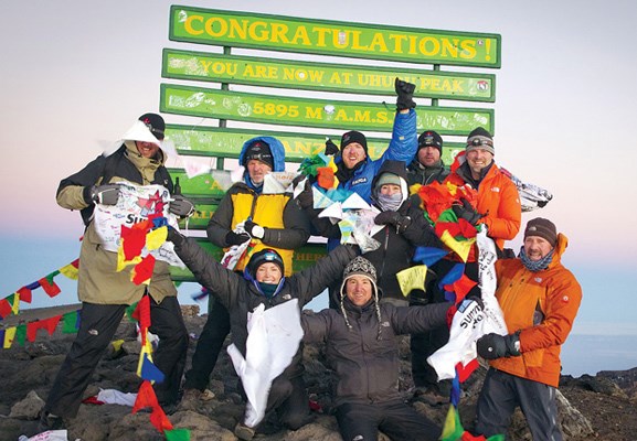 The 2012 Kilimanjaro Summits of Hope team celebrate their ascent. Seated in the middle of the front row is Ridgeview elementary vice-principal Craig Cantlie and in the back row, second from right, is North Vancouver resident Jason Lawson.