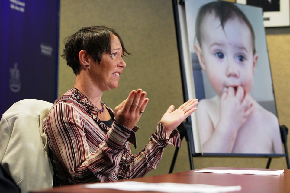 Tasha Brown speaks to the media at Saanich police headquarters in 2016. A photo of her missing daughter, Kaydance, is on an easel.