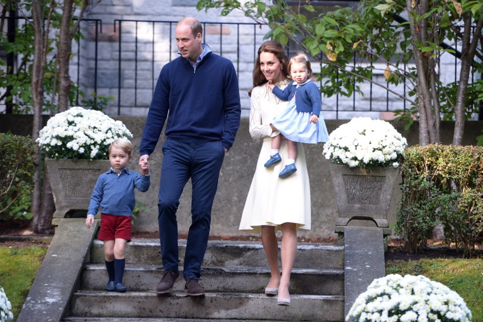 Prince William, and his wife Kate, the Duke and Duchess of Cambridge, arrive at a tea party with their children Prince George and Princess Charlotte at Government House in Victoria, Thursday.