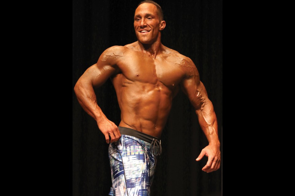 Local bodybuilder Jason Keller poses for the judges as he takes part in the Iron Ore Classic bodybuilding competition on Saturday at Vanier Hall. Citizen Photo by James Doyle October 1, 2016