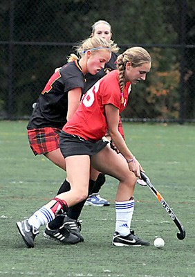 West Van (black) and Carson Graham Secondary school's Senior field hockey teams.