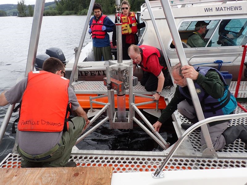 Researchers take samples on Quesnel Lake using a specialized corer on loan from the Bedford Institute of Oceanography (Fisheries and Oceans Canada) in Halifax.