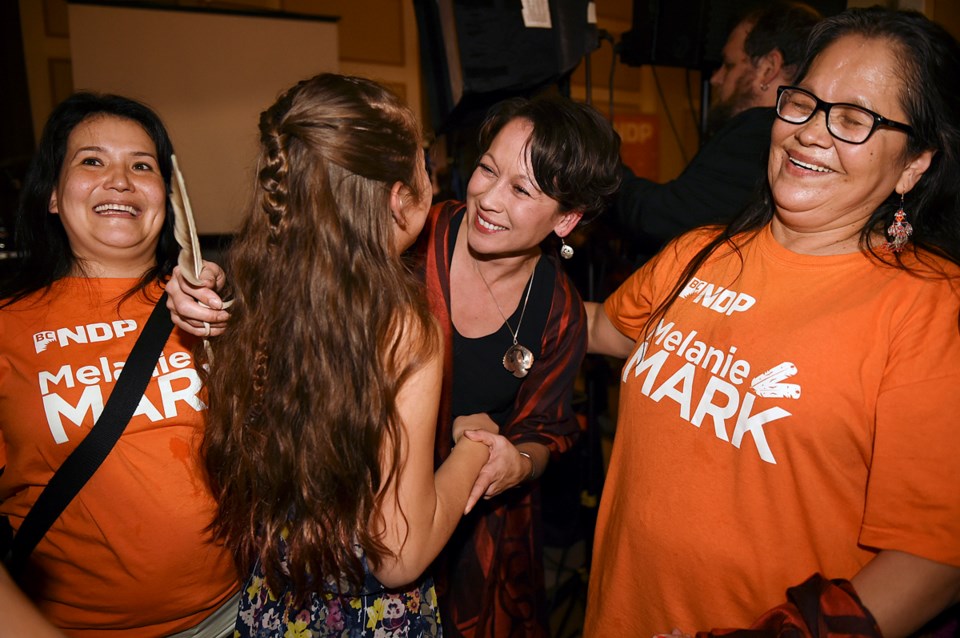 Melanie Mark celebrates her byelection victory in February with supporters, including her mother Yvo