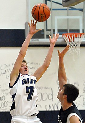 Collingwood Cavaliers #7 Jack Campbell (white) battles against Elphinstone Cougars for the Howe Sound AA Boys Basketball Championship at Collingwood Secondary School.
