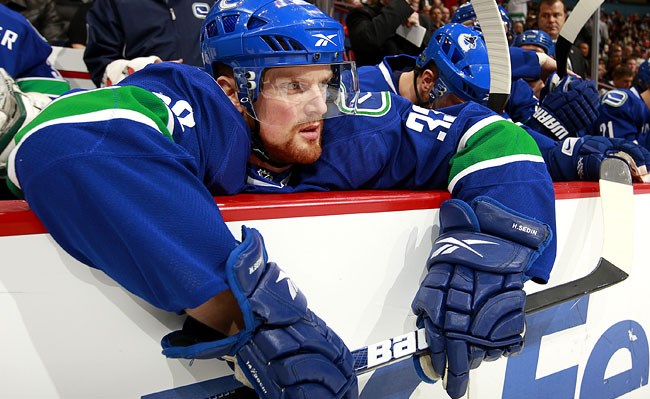 Henrik Sedin is weighed down