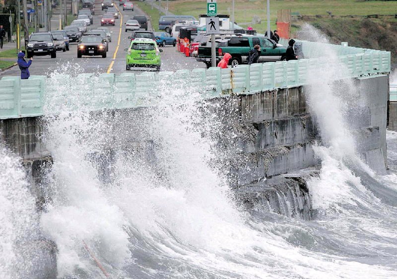 Waves lash Dallas Road seawall near Ogden Point on Friday afternoon. - photo