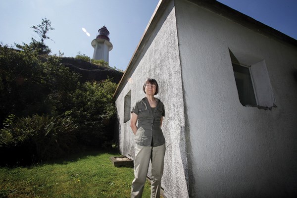 Elaine Graham remains the only resident among the historical buildings at Point Atkinson Lighthouse station. She still lives in the home she shared with her husband, one of the last keepers of the lighthouse before it was automated in 1996. Structures at the station, including this army blockhouse circa 1940, are in need of repair.