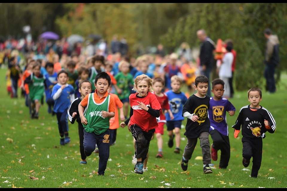 In the youngest race, 148 boys in kindergarten and Grade 1race around Trout Lake in the annual Vancouver elementary school cross-country meet at John Hendry Park on Oct. 20, 2016. Photo Dan Toulgoet