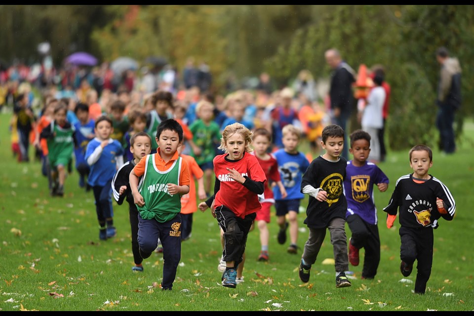 In the youngest race, 148 boys in kindergarten and Grade 1race around Trout Lake in the annual Vancouver elementary school cross-country meet at John Hendry Park on Oct. 20, 2016. Photo Dan Toulgoet