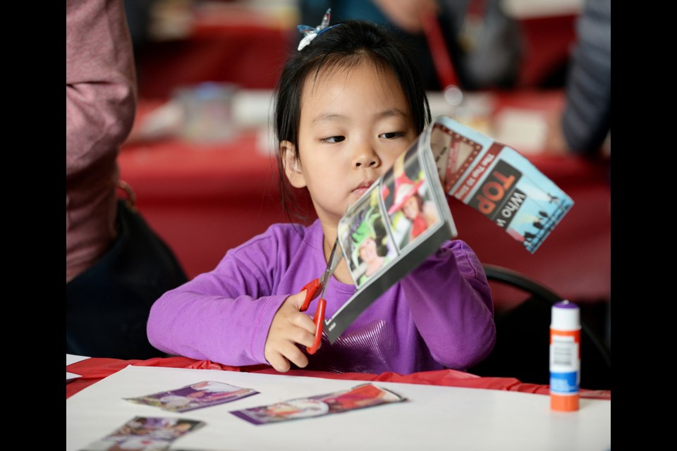 Grace Zeng, 4, works on her art project at the Shadbolt Centre for the Arts at Saturday's Art on the Spot session.