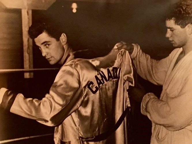 Harold Mann slips into a Team Canada robe during his prime as an amateur boxer in this undated handout photo. Mann died on Sunday at the age of 78 after a long battle with Alzheimer’s disease.