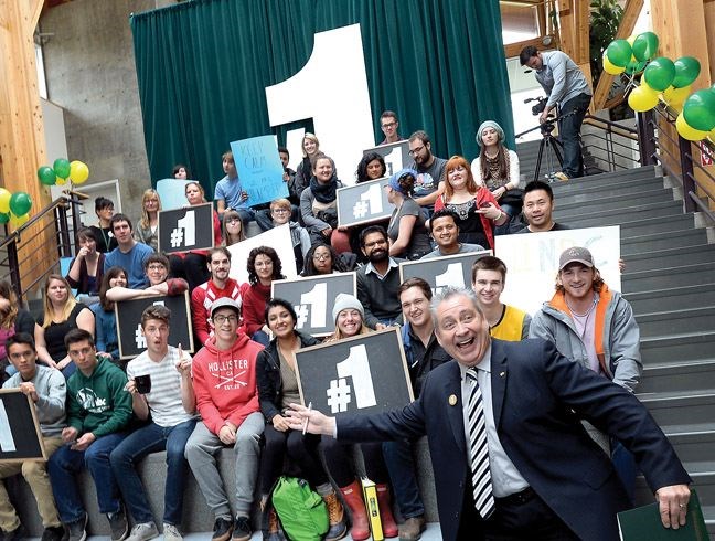 UNBC President Daniel Weeks gets in on a photo during a celebration for UNBC being named #1 university in Maclean's Magazine in October 2015.