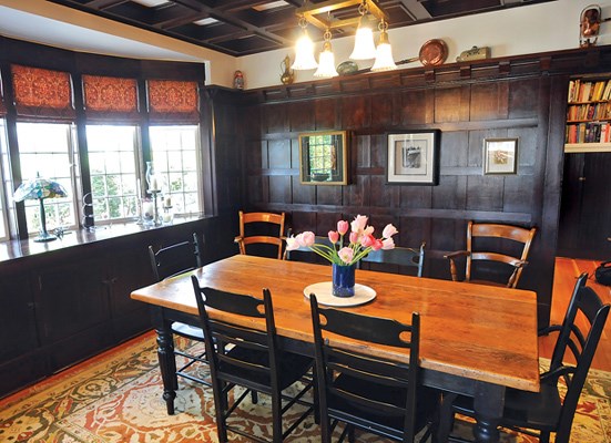 The North Vancouver home of Gillian Welsh and David Pike has undergone a major renovation, but the couple were careful to keep details of its original Craftsman-style design, including the woodwork in the dining room.