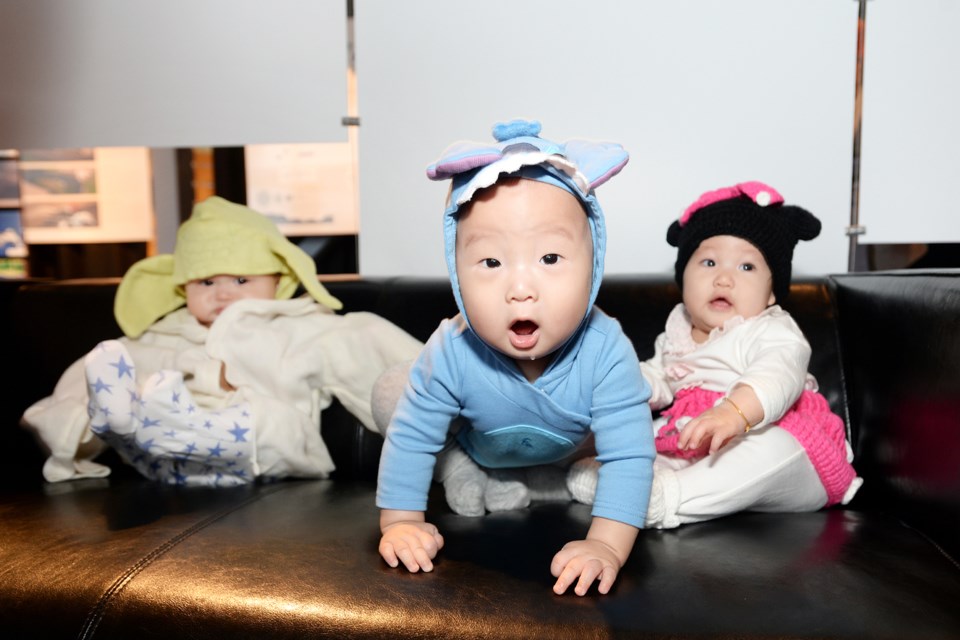 Seven-month-old Ethan Wong, dressed as Stitch (in centre), seven-month old Alexander Taylor, dressed as Yoda, and four-month-old Isabel Yao, dressed as Minnie Mouse were among the small humans who turned out for Fangtastic Halloween at Fraser River Discovery Centre.