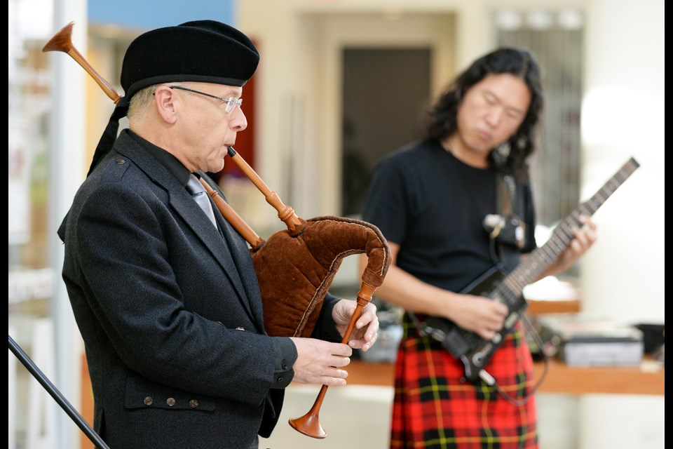 Joe MacDonald and Andrew Kim perform as Kimchi Haggis.