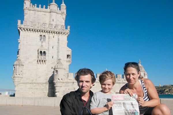 Benjamin Six and his parents Bernardo Six and Andreia Valente take the North Shore News to the Belem Tower in Lisbon, Portugal.