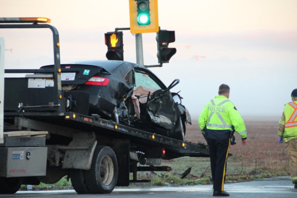 The Honda Civic involved in Sunday morning's fatal crash is towed away