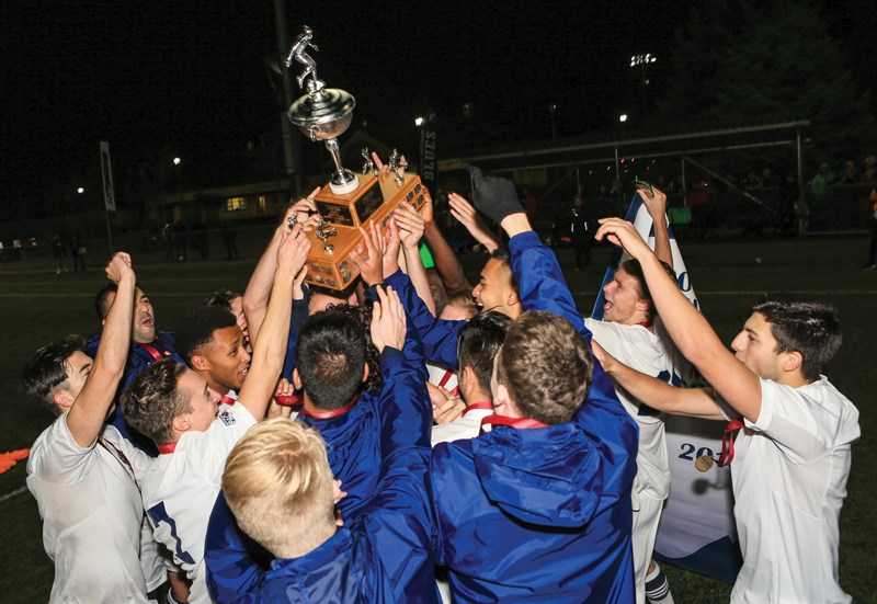 The Capilano Blues celebrate their second straight PacWest men’s soccer championship victory following a 4-2 win over Douglas College Saturday night at Burnaby Lake Sports Complex West. The Blues were undefeated all season in PacWest play. photo Paul Yates/Vancouver Sports pictures