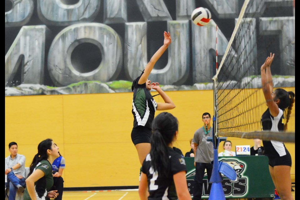 Burnaby Mountain's Taran Jhuti spikes the ball towards the Burnaby South court during last week's senior girls league game.