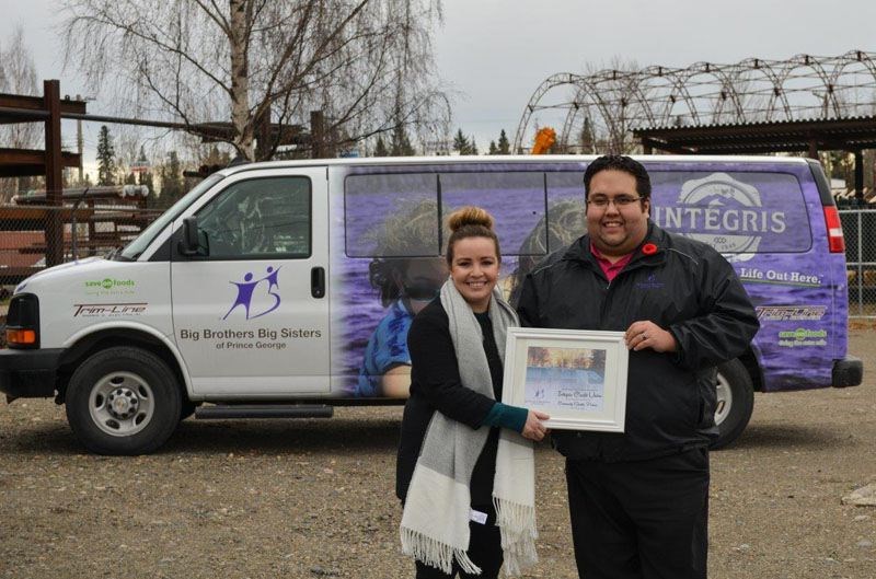 Big Brothers Big Sisters of Prince George executive director Tim Bennet, right, stands with Integris Credit Unions Mandy Dubois. On Thursday the non-profit  announced a multi-year partnership worth $75,000 with Tyrod Industries Ltd, Integris Credit Union, Save on Foods, Trimline Signs and Electrical and Obsession Automotive and Sales.