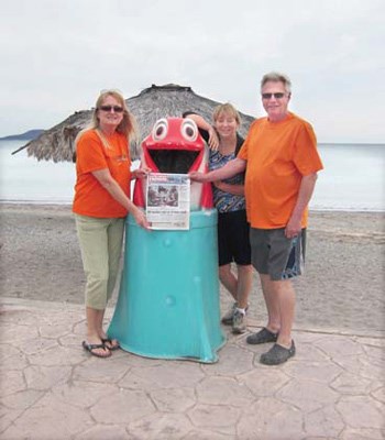 Yvonne Van Soldt, Yvonne Stich and Ed Van Soldt visit a dolphin in Loreto, Mexico.