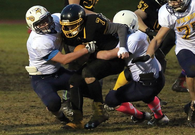Duchess Park Condors player Jacob Cundy breaks through the Nechako Valley Vikings defence at Masich Place Stadium on Friday as the two teams met in the P.G. Bowl Northern Conference double-A varsity championship game.