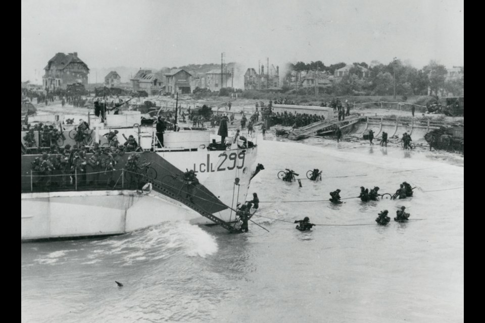 Canadian troops land at Berni&egrave;res-sur-Mer in France on D-Day, June 6, 1944. The bicycles that soldiers were carrying were intended for a fast break inland that was cut off by German resistance.