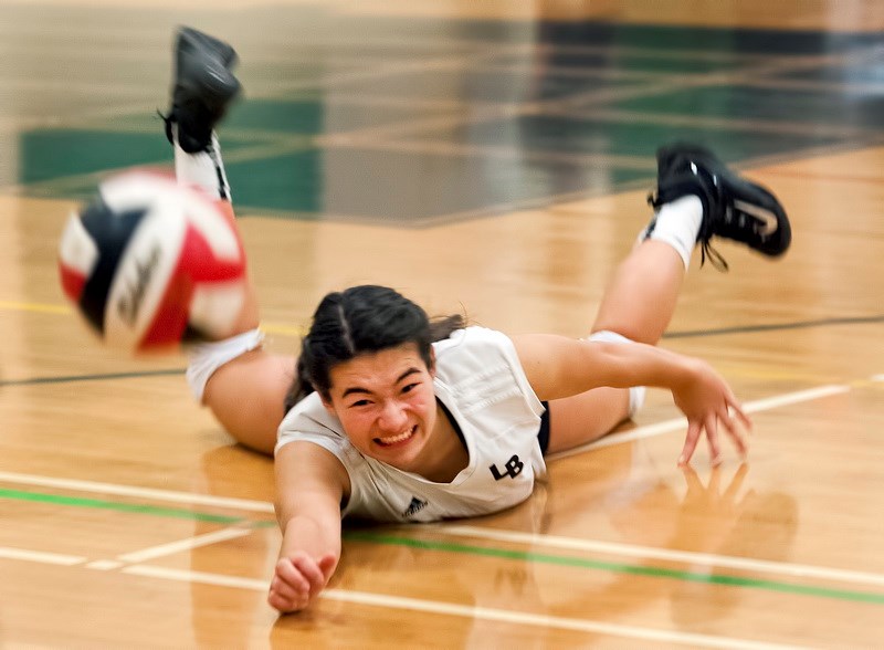 Lord Byng Grey Ghost libero Kaya Sokukawa (no. 6) diving for the ball in the senior girls city volleyball championship at Van Tech secondary Nov. 4, 2016. Photo Chung Chow