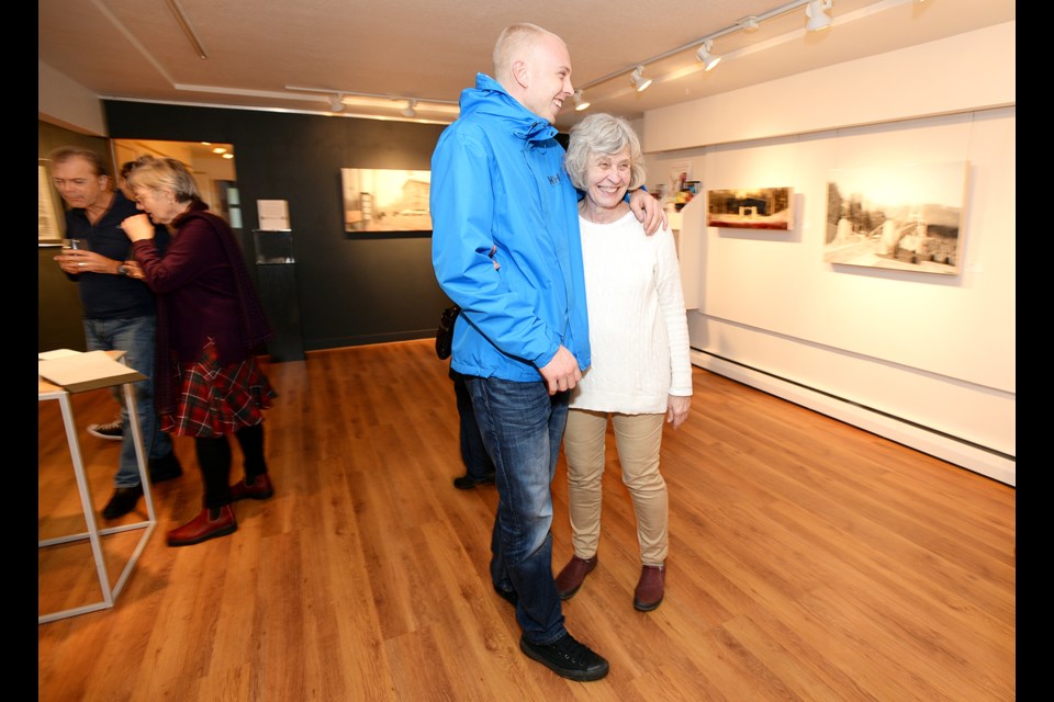 Artist Sabine Simons and her son, Rhys James, at the opening of Retrospective Views at the Deer Lake Gallery.