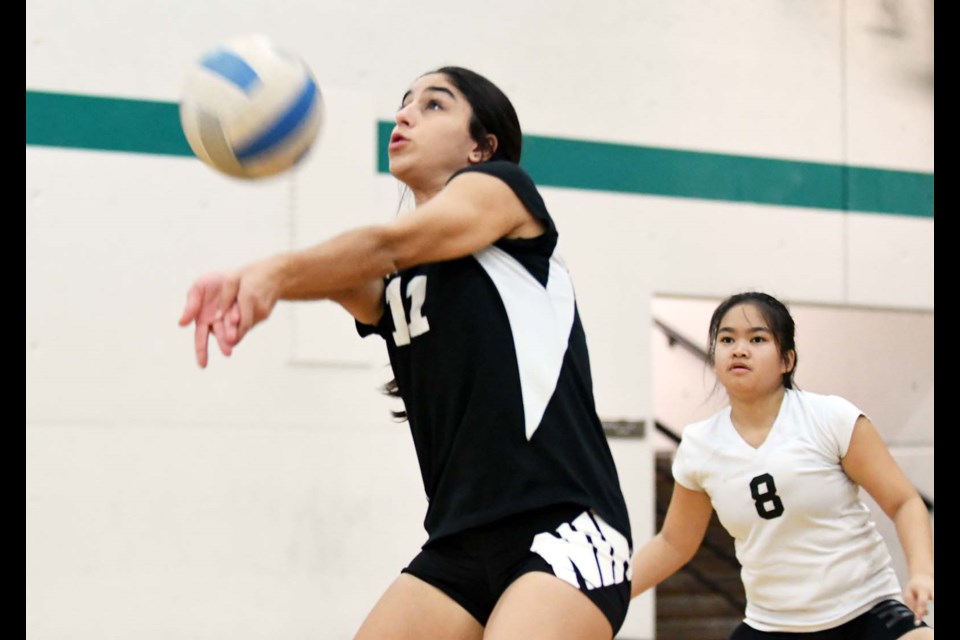 The Burnaby South Rebels junior girls volleyball team jumped into the fray at Douglas College’s Invitational tournament on the weekend and exited with a lot of great experience. Above, South’s Isabella Silva bumps the ball while libero Nickole Villamin watches.