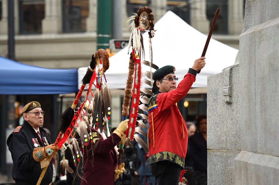 Robert Nahanee makes his way around the cenotaph during the ceremony. photo Dan Toulgoet