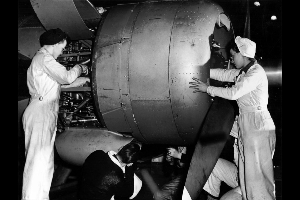 Female Boeing employees work on one of the engines. Vancouver Archives photo