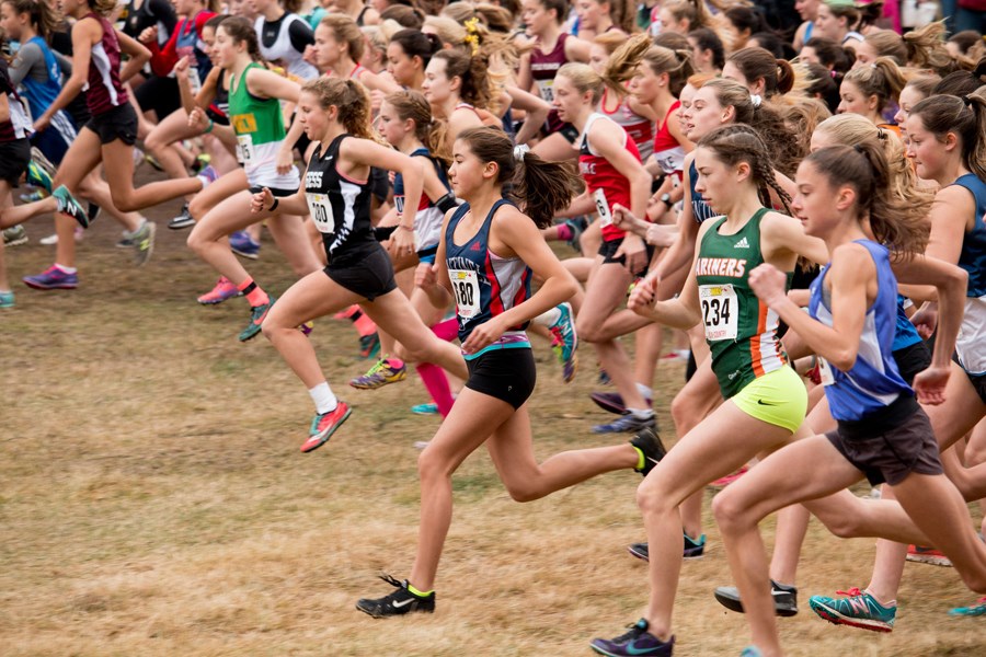 Sentinel's Emmajean Neal (centre) leads the field off the starting line at the provincial cross-country running championships held Saturday in West Kelowna. photo by Kerith Paterson