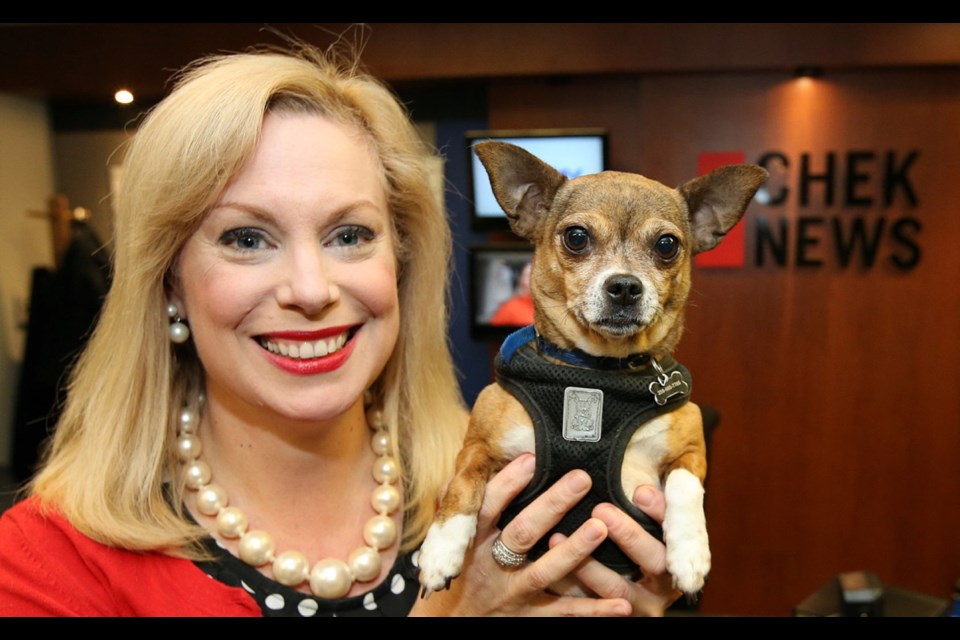 CHEK News anchor Tess van Straaten and her three-year-old rescue dog Bella at Chek's 60th-birthday celebrations last week.
